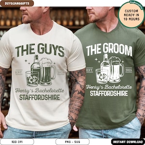 May include: Two t-shirts, one cream and one olive green, with matching graphic designs. The cream shirt says "THE GUYS" and the green shirt says "THE GROOM". Both shirts feature a bottle, a beer mug, a glass of ice, and the text "Henry's Bachelorette STAFFORDSHIRE".