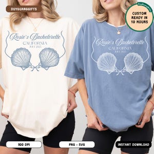 May include: Two t-shirts, one cream and one blue, featuring a seashell design and the text "Rosie's Bachelorette CALIFORNIA JULY 2025". The shirts have a relaxed fit and are suitable for a bachelorette party.