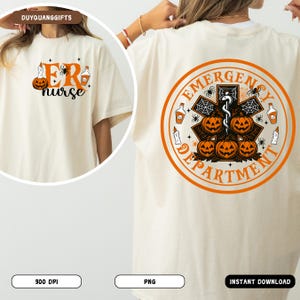 May include: Cream-colored t-shirt with Halloween-themed graphics. The front features "ER nurse" with pumpkins and a spider. The back displays an orange circular design with "Emergency Department" and Halloween elements. The shirt is a festive apparel item.