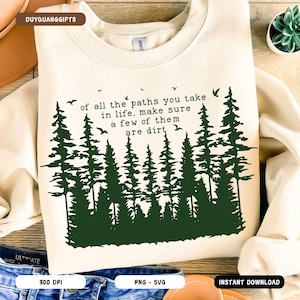May include: A cream-colored sweatshirt with a green forest silhouette and the text "of all the paths you take in life, make sure a few of them are dirt".
