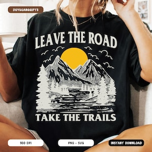 May include: Black t-shirt with a white graphic design featuring a mountain range with a yellow sun and the text "Leave the Road Take the Trails".