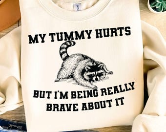 My Tummy Hurts But I'm being Really Brave About It PNG, Funny Raccoon Meme Png, Retro Trash Panda Png, Vintage Chronic Illness Shirt Design