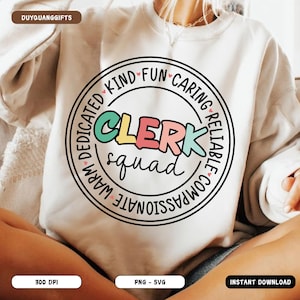 May include: Cream-colored sweatshirt featuring a circular graphic with the words "CLERK squad" in colorful letters. The graphic is surrounded by words like "Kind," "Fun," and "Dedicated."