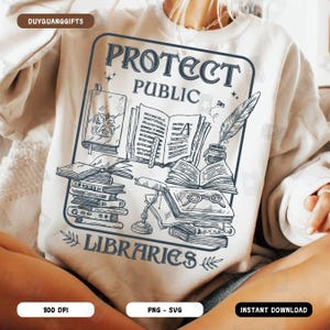 May include: A white sweatshirt with a graphic design that says "Protect Public Libraries". The design features a stack of books, a quill pen, a pair of glasses, and a lamp.