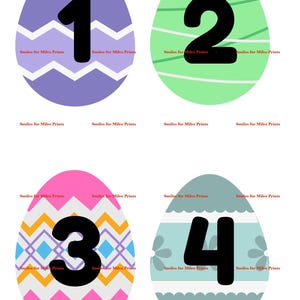 May include: Four Easter egg designs with numbers 1 through 4. Each egg is a different color and pattern, including purple with a chevron design, green with stripes, pink with geometric shapes, and blue-green with floral accents. The text "Smiles for Miles Prints" is repeated around each egg.