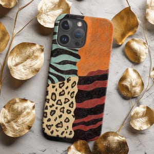 Leopard Patchwork Phone Case brings bold, vibrant boho flair with turquoise zebra waves, burnt orange fields and beige leopard spots