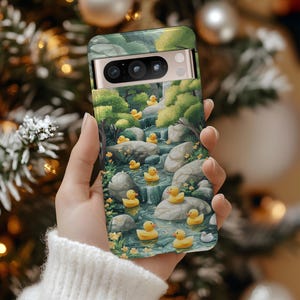 Woodland Rubber Ducks Pixel Case pairs playful storybook charm with yellow ducks, teal stream and gray boulders for a whimsical, serene vibe