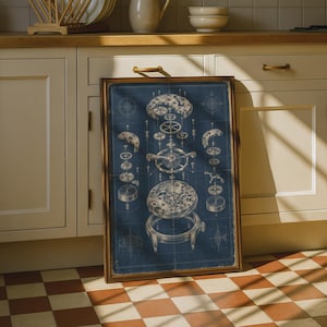 May include: A framed rectangular print featuring a detailed technical blueprint of a mechanical watch movement in white lines on a dark blue background. The exploded view displays various gears, springs, and the watch case in a vertical arrangement.