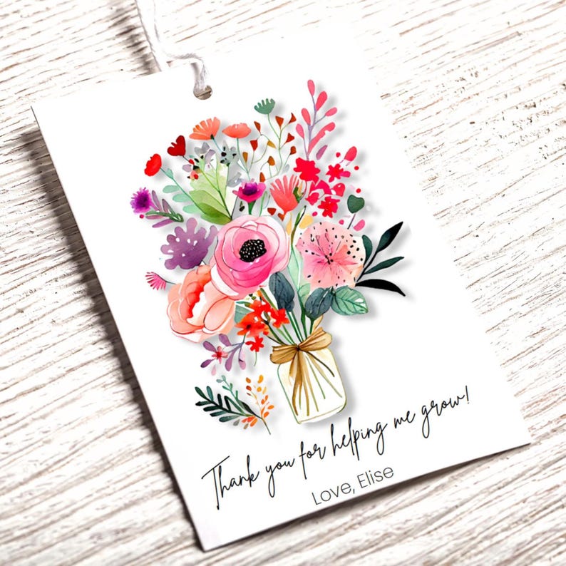 May include: A white gift tag with a watercolor illustration of a bouquet of pink, red, and purple flowers in a mason jar. The text on the tag reads "Thank you for helping me grow! Love, Elise."