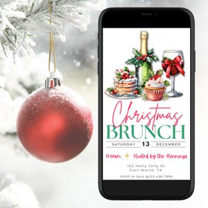 May include: A smartphone displays a Christmas Brunch invitation with watercolor illustrations of food and drinks. The invitation includes the text "Christmas Brunch" and event details. A red ornament hangs in the foreground.