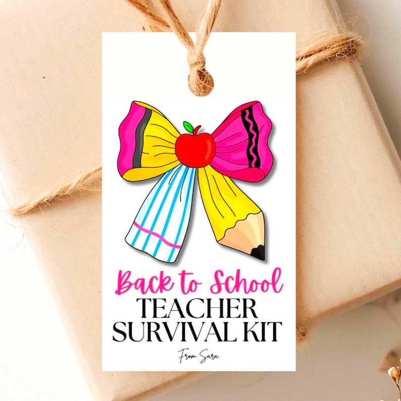 May include: A white tag with a colorful school-themed bow design. The bow features a red apple center, yellow pencil, and pink and blue ribbon. Below the bow, the tag reads 'Back to School Teacher Survival Kit' with 'From Sara' below. The tag is tied with twine.