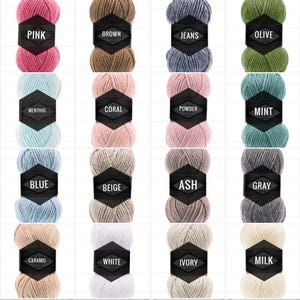 May include: A collection of 16 yarn skeins in various colors, including pink, brown, blue, beige, ash, gray, caramel, white, ivory, and milk. Each skein has a label with the color name.