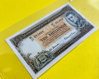 10 SHILLINGS. 1954-60 Year. Commonwealth of Australia. Legal Tender. Serial# AE/37 093468. Matthew Flinders. U N C. No GRADED.