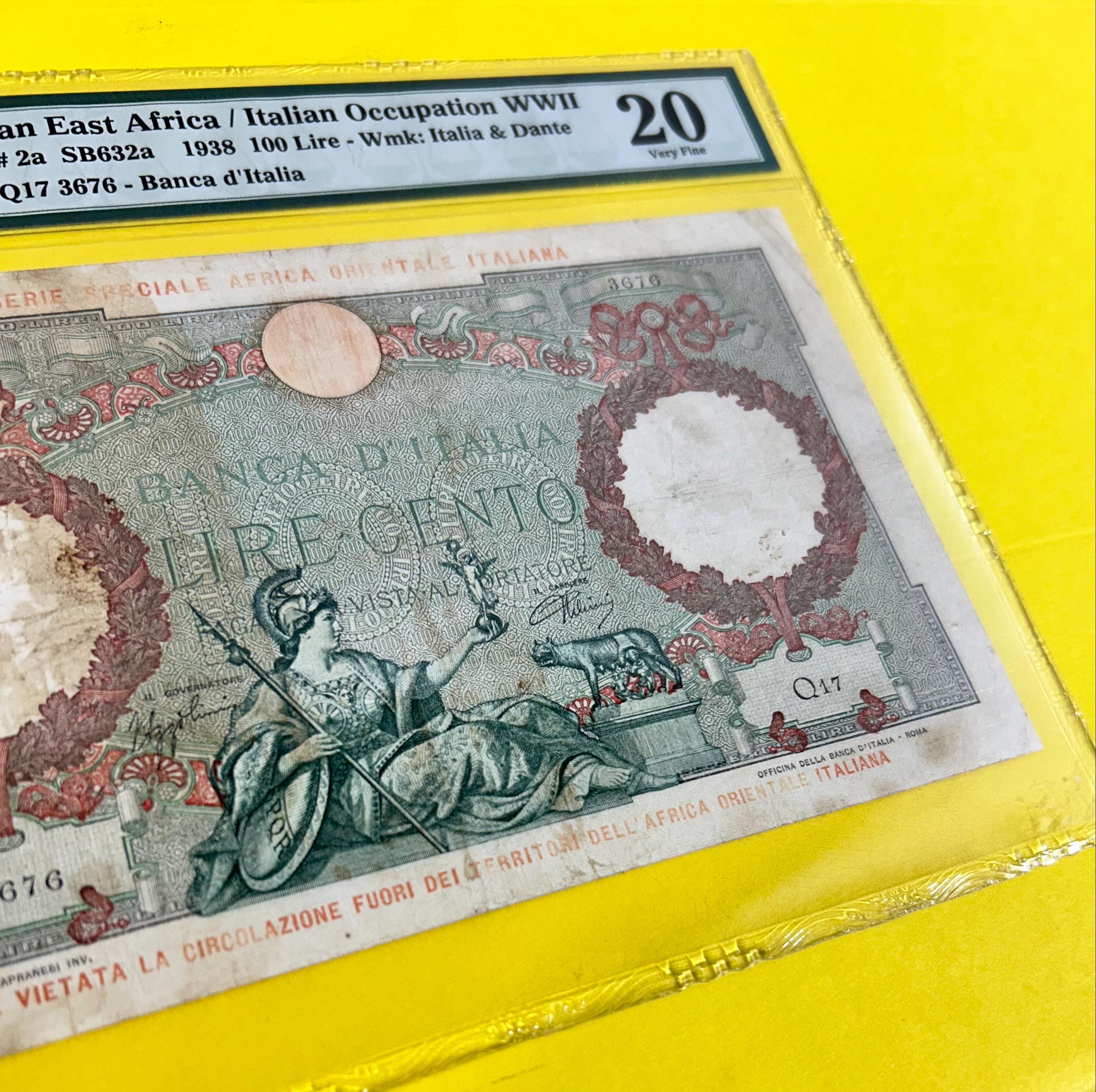 100 LIRE. 1938. Italian East Africa / Italian Occupation W W I I. Banca d'Italia.  S/N Q17 3676. Pick# 2a. Italia & Dante. 20 PMG GRADED.
