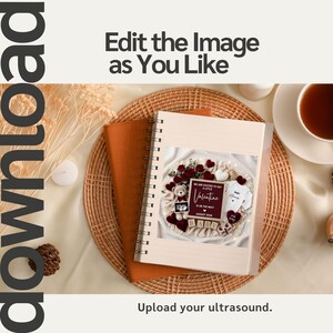 May include: A spiral-bound notebook with a photo of a baby announcement. The announcement includes a teddy bear, ultrasound image, and the text "We are excited to say a little Valentine is on the way August 2025 Baby". The notebook is on a woven mat.