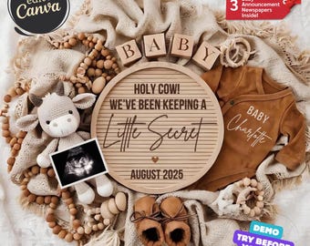 May include: A wooden sign with the text "Holy Cow! We've Been Keeping A Little Secret" and the date "August 2025". The sign is surrounded by a variety of baby items, including a brown onesie, a stuffed cow, wooden blocks spelling "Baby", and a pair of brown booties.