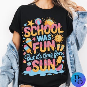 May include: Black t-shirt with a vibrant summer graphic. The design includes the text "SCHOOL WAS FUN But it's time for SUN" in a playful font, accompanied by illustrations of ice cream, a sun, and a watermelon slice.