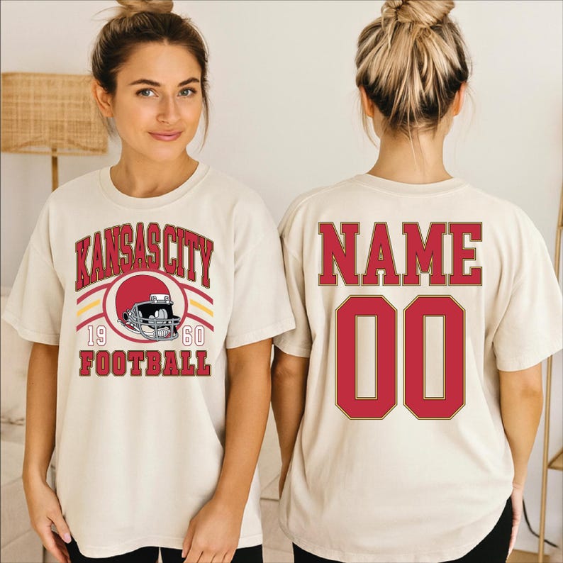 A woman wearing a white t-shirt with a graphic design and text printed on it.