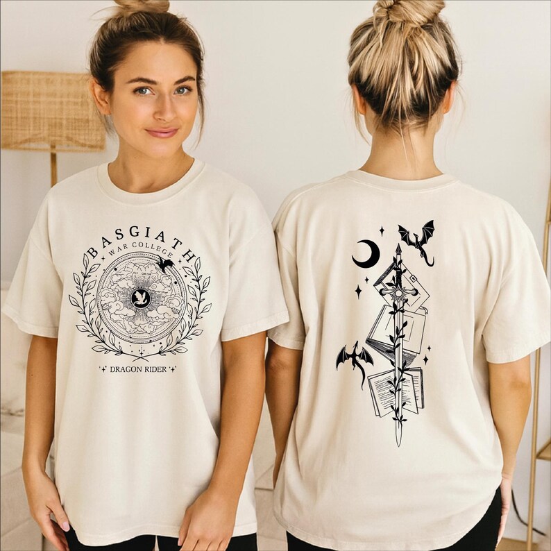 A woman wearing a white t-shirt with a graphic design on the front and a back featuring a black illustration of a dragon and a crescent moon.
