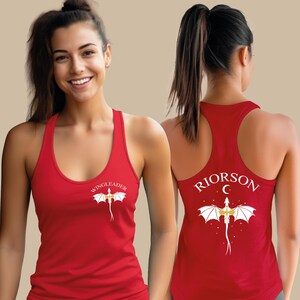 A smiling woman wearing a red tank top with a dragon design and the text "Riorson" printed on the back.