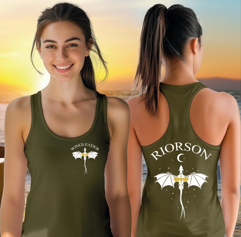 A smiling woman wearing a green tank top with a dragon design and the text "WINGLEADER" printed on it.