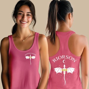 A woman wearing a pink tank top with a dragon design and the text "WINGLEADERRI" printed on it.