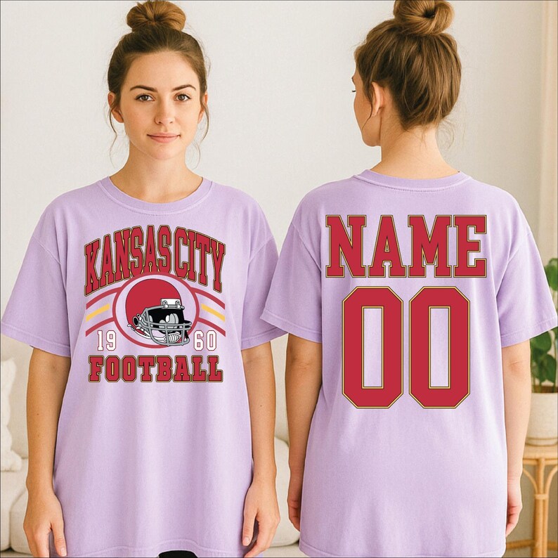 A woman wearing a purple t-shirt with the text "KANSAS CITY" and "1960 FOOTBALL" printed on it.