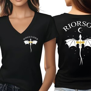 A woman wearing a black t-shirt with a white dragon design and the text "WINGLEADER" printed on it.