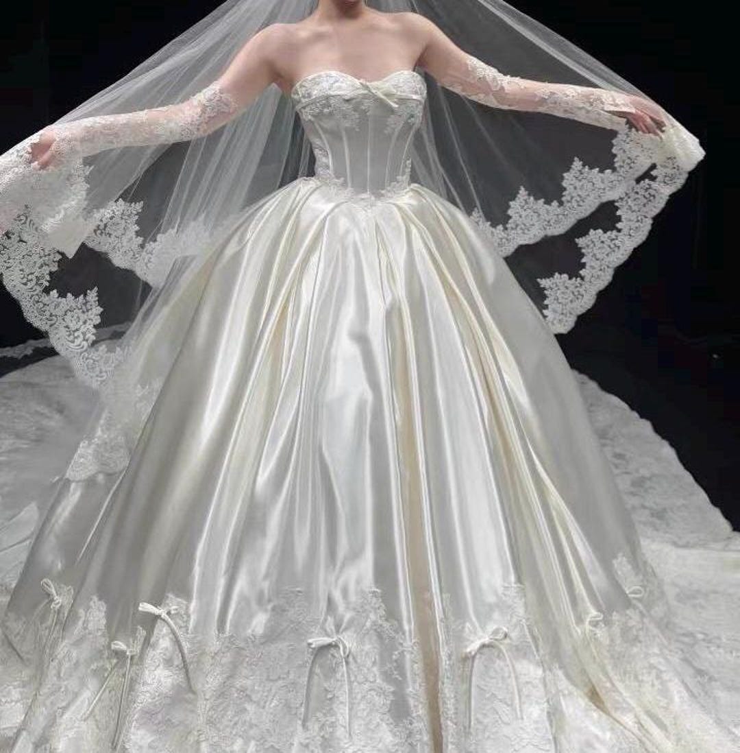 Sophisticated A-Line Bridal Gown with a Satin Belt for a Refined Look