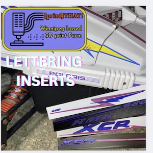 May include: Image shows lettering inserts for a Polaris snowmobile. The inserts display various designs and colours, with text including "600", "RMK", and "XCR". The image also includes the text "{print}THAT!" and "Winnipeg based 3D print Farm".