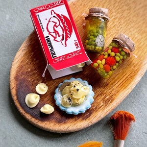 Miniature cooking set of dumplings with jars