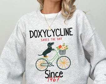 Doxycycline Pharmacy Pun Sweatshirt, Dachshund On Bicycle Pharmacist Shirt, Veterinary Gift, Pharmacy Tech Sweater, Funny Pharmacist Gift