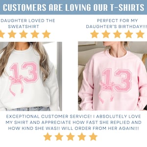 May include: Two photos of a white and a pink sweatshirt with a pink number 13 and a pink bow on the front. The text "MY DAUGHTER LOVED THE SWEATSHIRT" and "PERFECT FOR MY DAUGHTER'S BIRTHDAY!!!!" are above each photo. Five gold stars are below each photo.