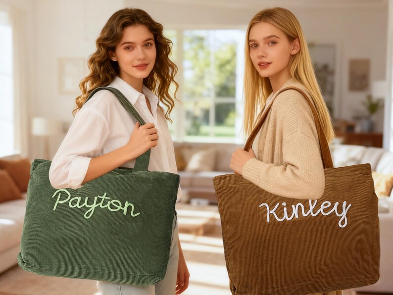 May include: Two corduroy tote bags, one green and one brown, each with a name embroidered in a contrasting color. The green bag says "Payton" in light green, and the brown bag says "Kinley" in white. Both bags have long handles.