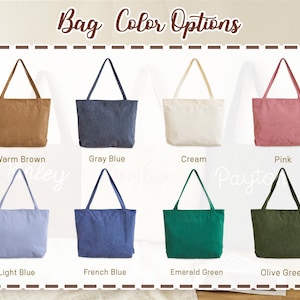 May include: An assortment of eight tote bags in various colors, including warm brown, gray blue, cream, pink, light blue, French blue, emerald green, and olive green. The image displays the text "Bag Color Options".