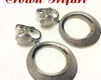 Crown Trifari textured silver hoop clip on earrings.