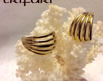 Designer signed Trifari cuff wrap gold metal pierced earrings.