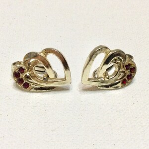 Vintage double entwined hearts with red rhinestones clip on earrings.