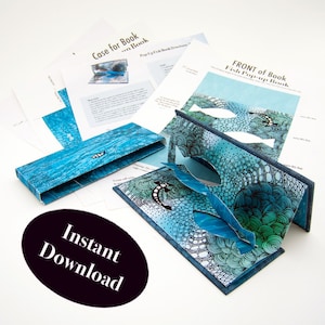 May include: A pop-up book with a fish theme, featuring blue and green ocean-themed illustrations. The book is open, displaying cut-out fish and aquatic designs. Accompanying papers include instructions and a case for the book. The words "Instant Download" are on a black oval.