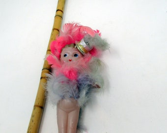 cupie doll on a stick