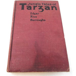 Livro antigo de Tarzan - Jungle Tales of Tarzan, de Edgar Rice Burroughs, 1919, primeira edição, capa vermelha