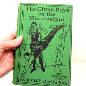 Vintage circusjongensboek uit 1912 – geïllustreerd avontuur op de Mississippi-rivier