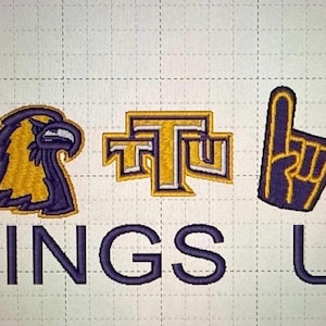 May include: Embroidered design featuring a winged foot, a stylized eagle head, a block letter logo, a foam finger, and a cross country symbol. The text "WINGS UP" is embroidered below the symbols. The design uses gold, navy blue, and white thread.