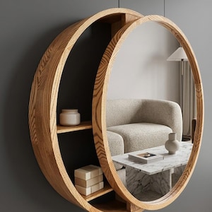 May include: A circular wooden wall-mounted unit featuring a natural light brown wood grain finish. The structure combines a round mirror on the right side with two open storage shelves on the left side, providing a functional display space.