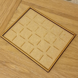May include: A wooden tray with a grid pattern, perfect for organizing small items.