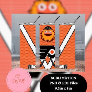 May include: Orange and black 20oz skinny tumbler with a Philadelphia Flyers theme. The tumbler features the team's mascot, logo, and hockey sticks. The tumbler is 23.6cm tall and 20.3cm wide.