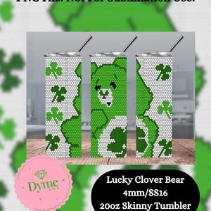 May include: A green and white tumbler with a clover and bear design. The tumbler is 20 ounces and is a skinny style. The text "Lucky Clover Bear 4mm/SS16 20oz Skinny Tumbler" is printed below the tumbler.