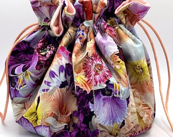 Tatting Bag #303.  Spring purple and peach flowers on purple background. Kona Dusty Peach lining. Peach drawstrings.