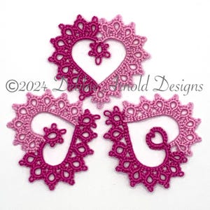 May include: Three pink and purple crocheted hearts with a delicate lace design. The hearts are arranged in a triangular pattern. ©2024 Debbie Arnold Designs