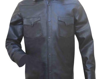 May include: Black leather shirt with two chest pockets and button-down closure. The shirt has a classic collar and long sleeves. A stylish, durable garment for various occasions.